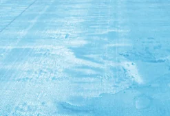 BACHE A BULLES PISCINE BOIS ALASKA BORDEE 4 COTES